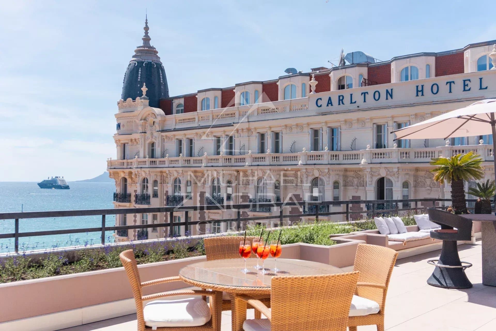 Terrace of a penthouse in Cannes with a view of the sea and the Carlton Hotel.