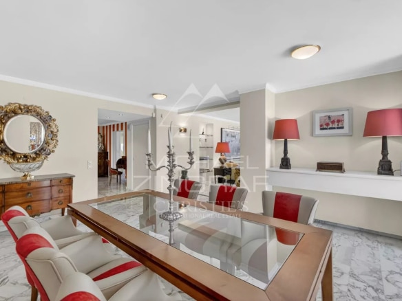 Interior of a penthouse in Cannes with elegant dining room and modern decor.