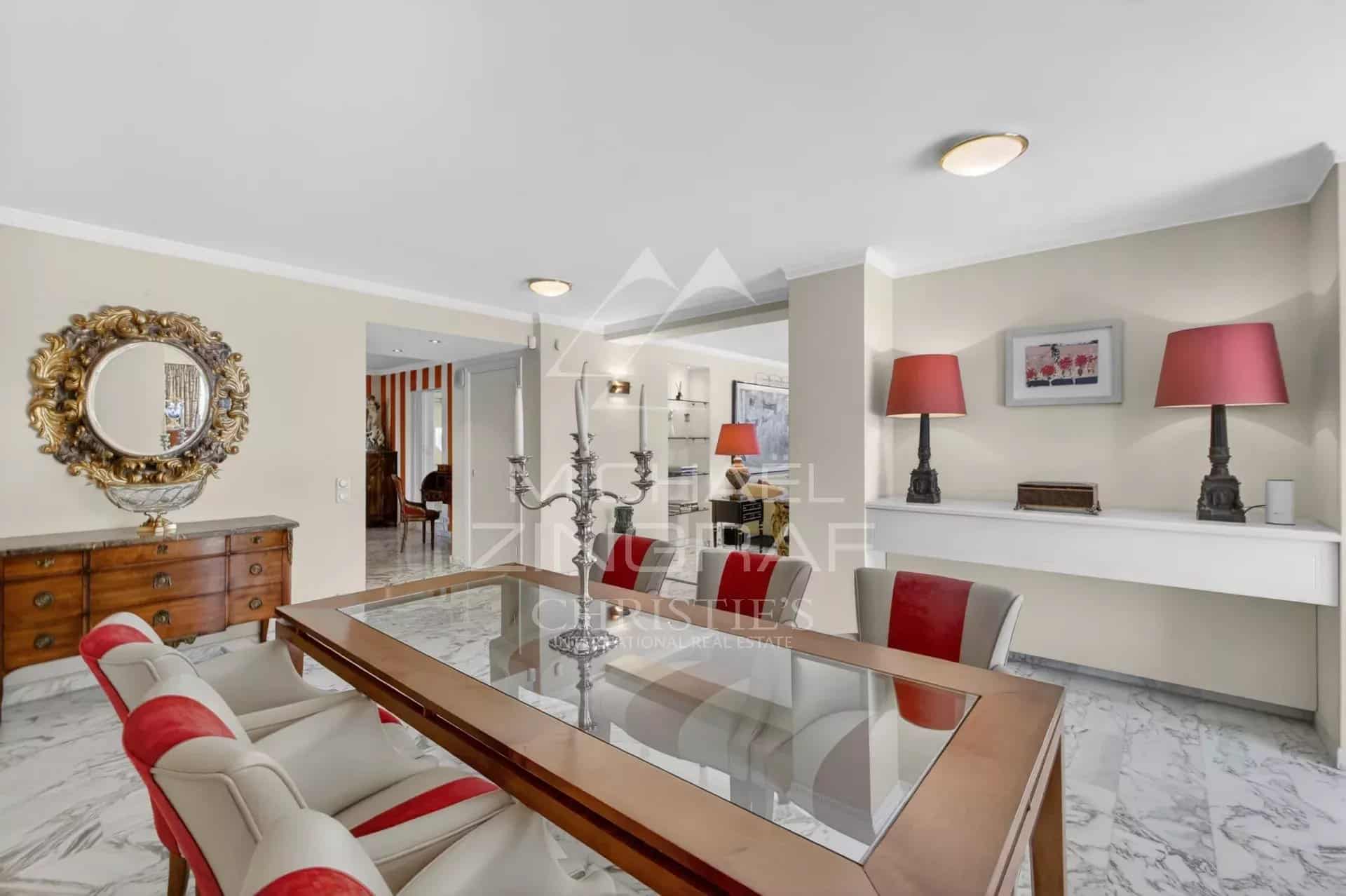 Interior of a penthouse in Cannes with elegant dining room and modern decor.