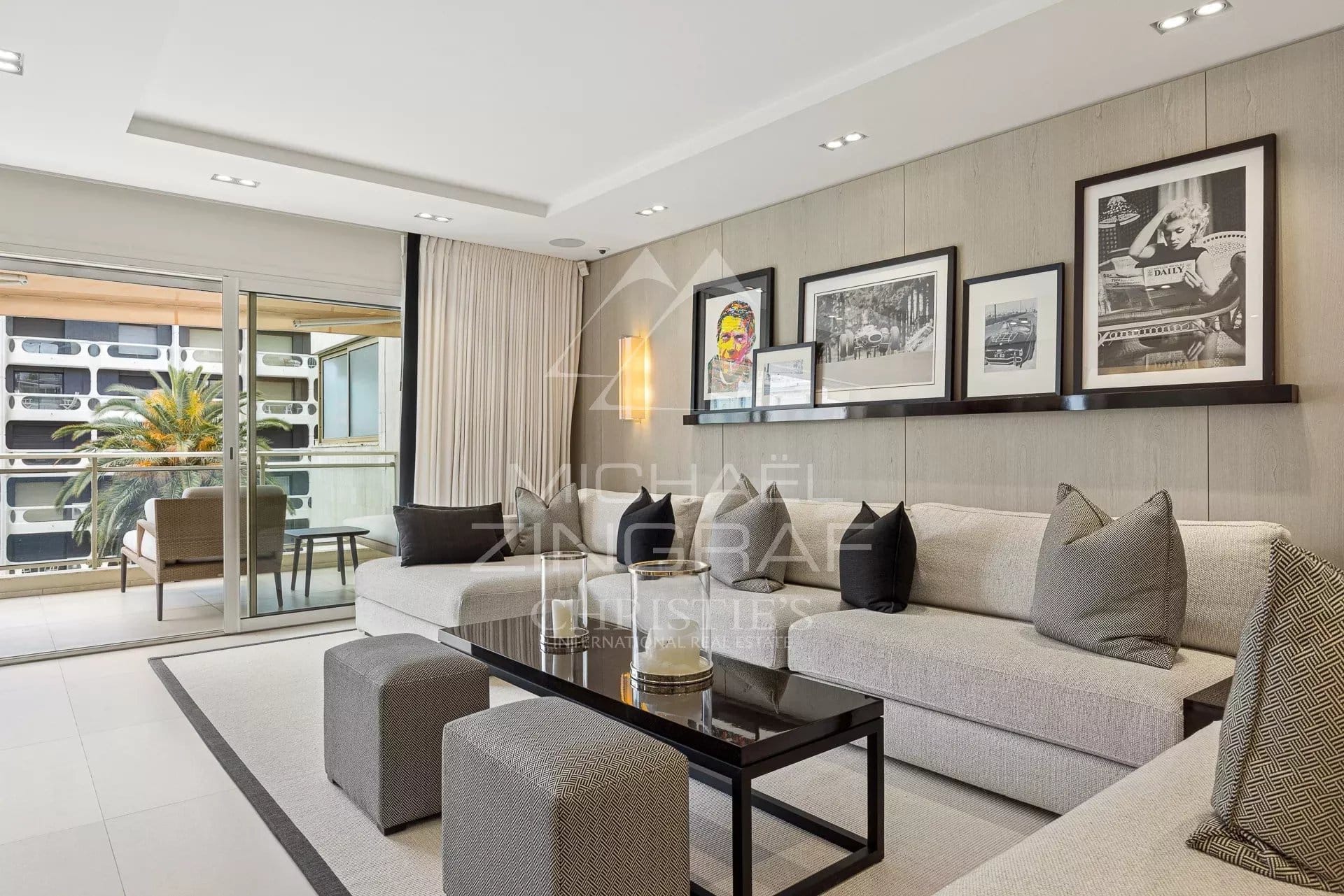 Living room of an apartment in Cannes Modern living room of an apartment in Cannes, with sofa, coffee table and access to a balcony.