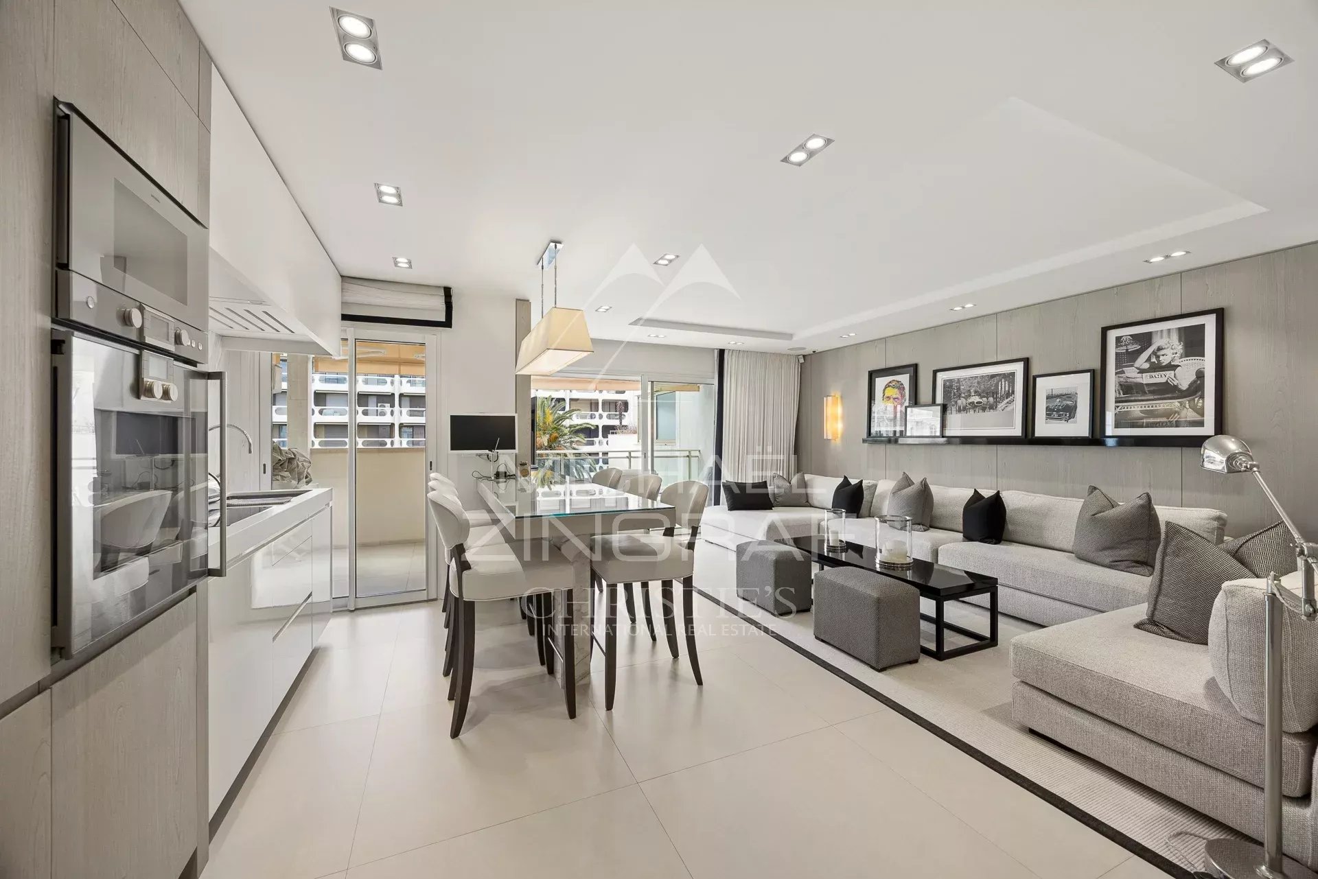 Modern apartment in Cannes Interior of a modern apartment with living room, dining room and open kitchen in Cannes.