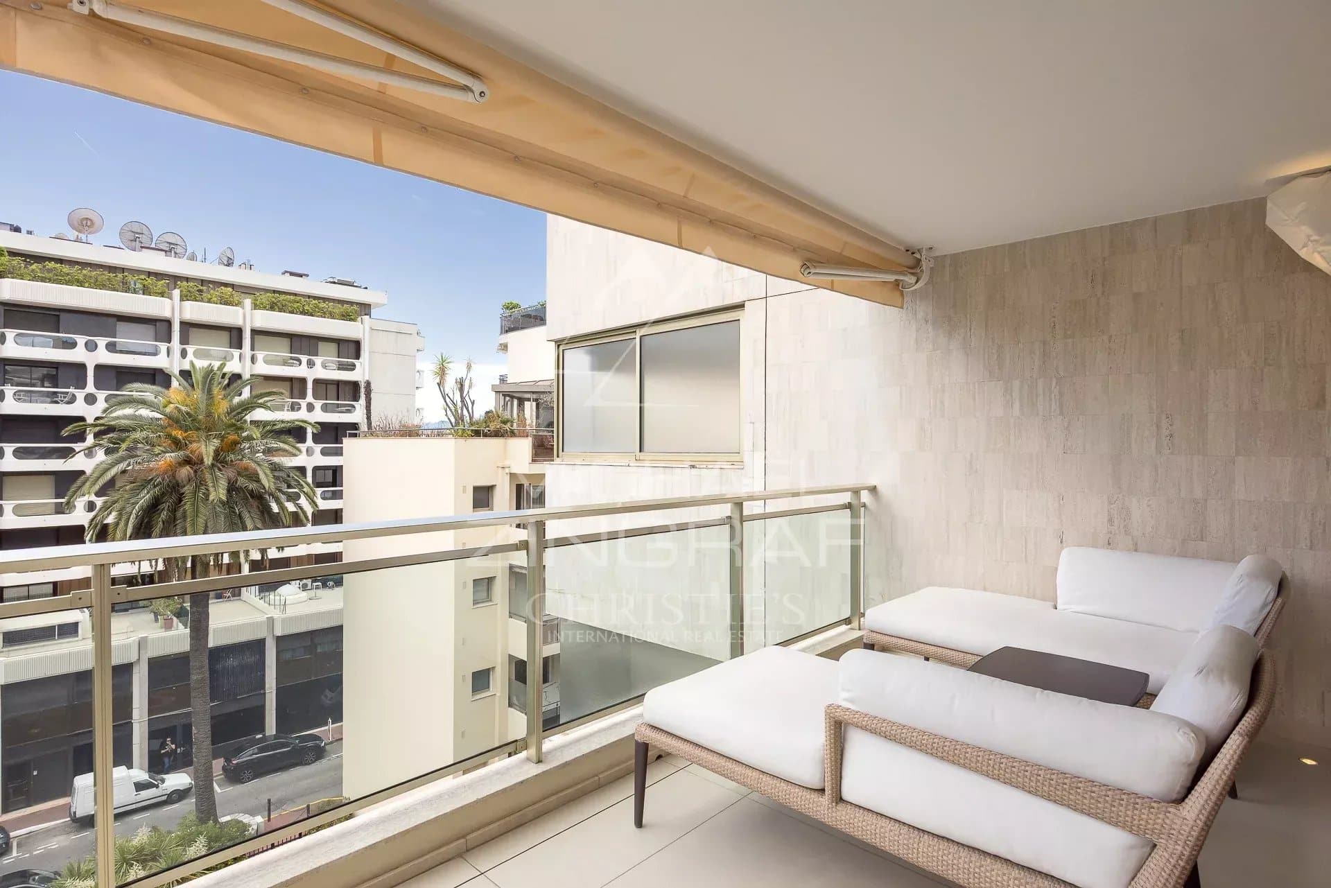 Apartment balcony in Cannes Balcony of an apartment in Cannes with a view of the street and the sky.