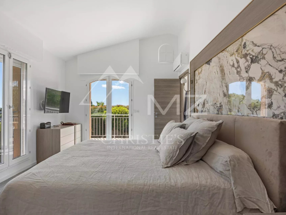 Room in a renovated family property with views of a green landscape.