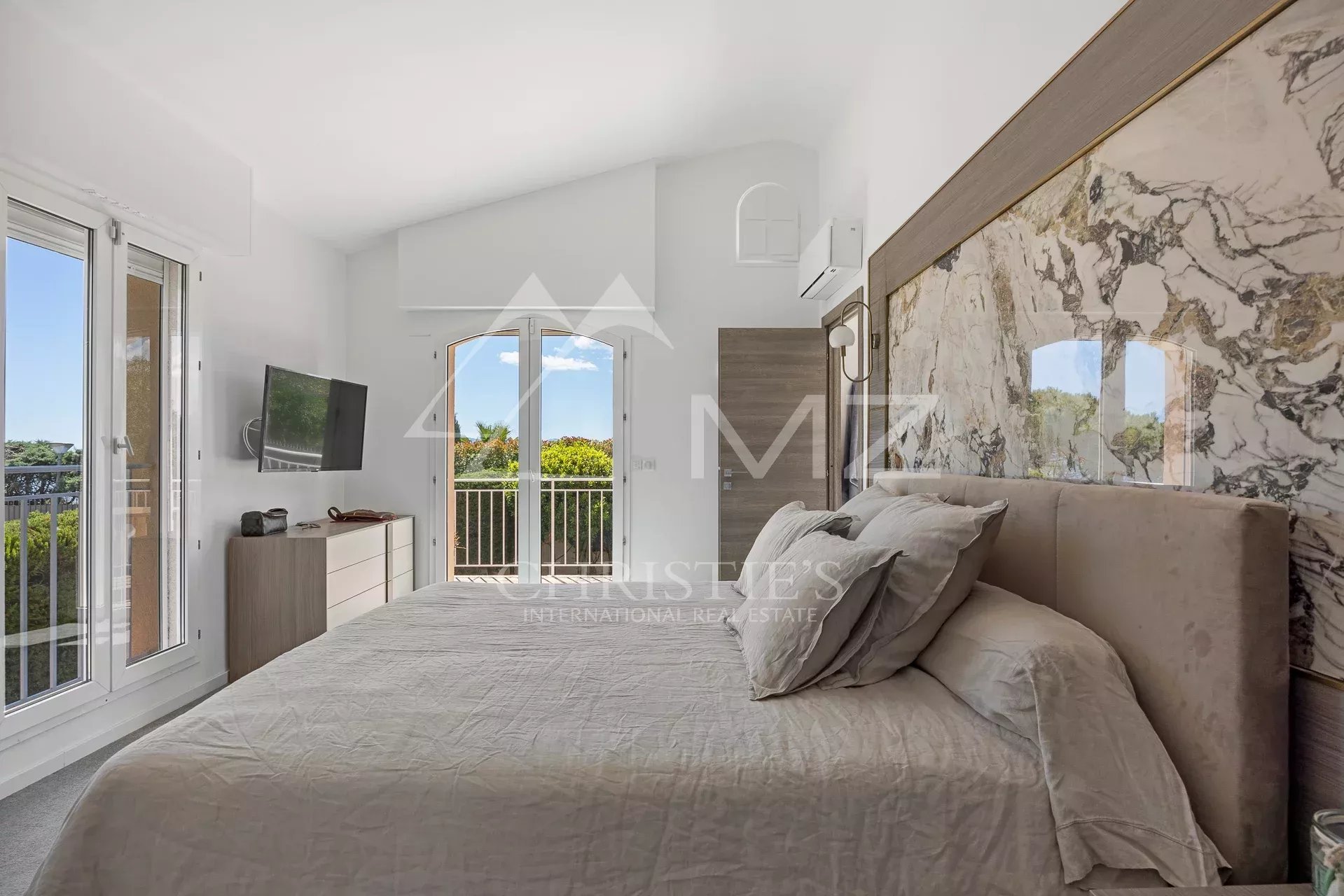 Room in a renovated family property with views of a green landscape.