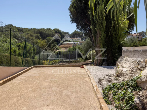 View of a path leading to a property with landscaped grounds in Vallauris.