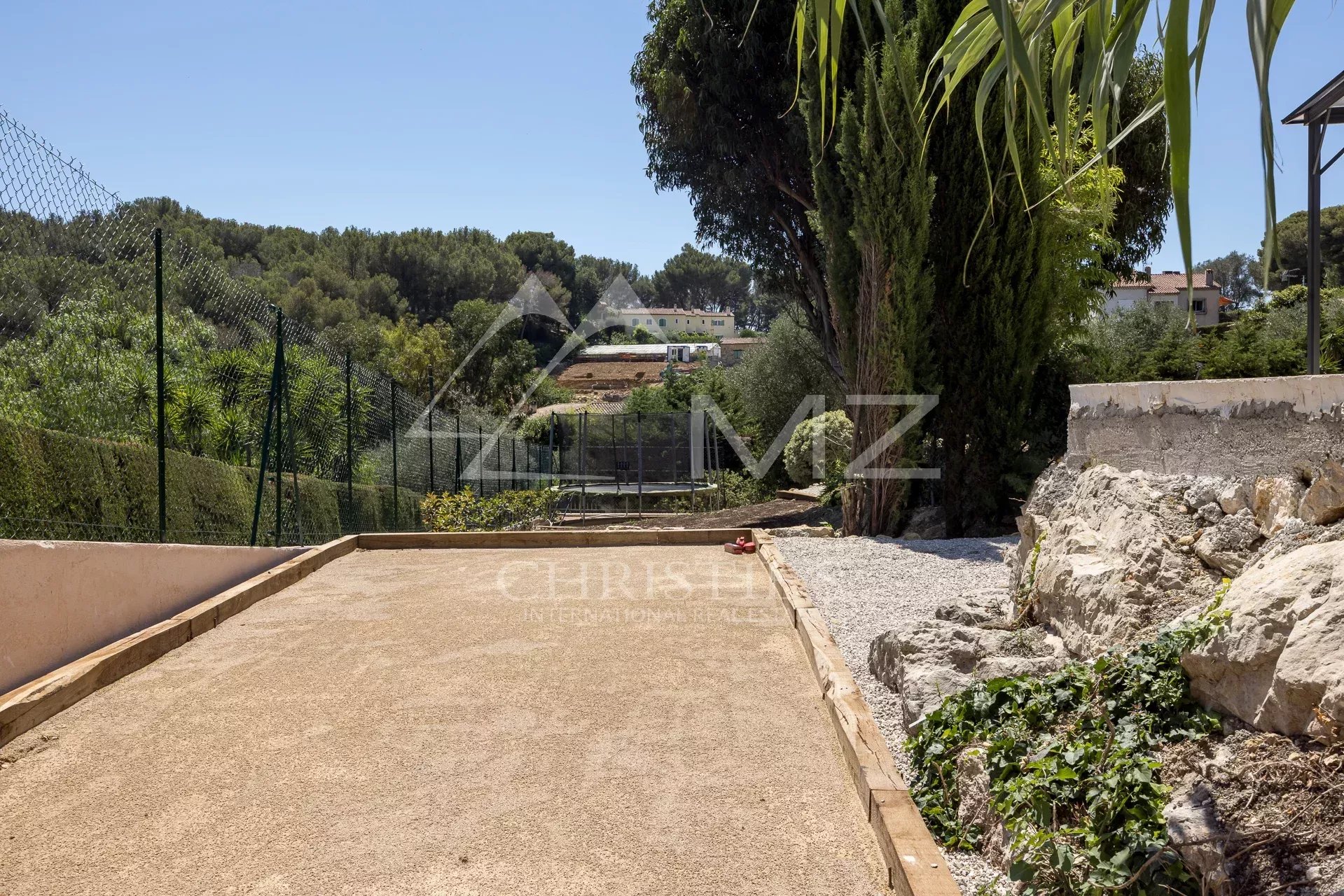 View of a path leading to a property with landscaped grounds in Vallauris.