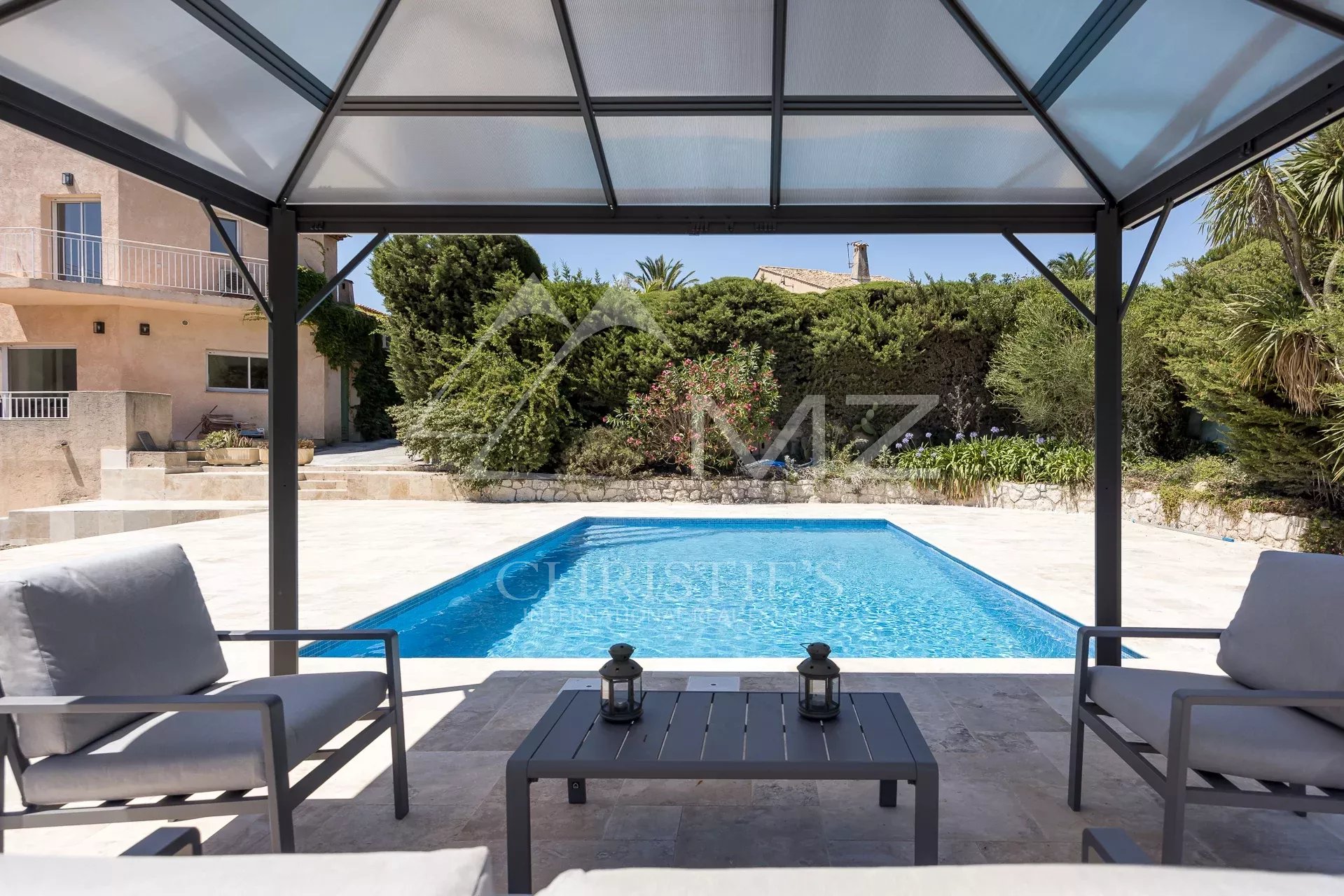 View of the pool and garden of a renovated family property in Vallauris.