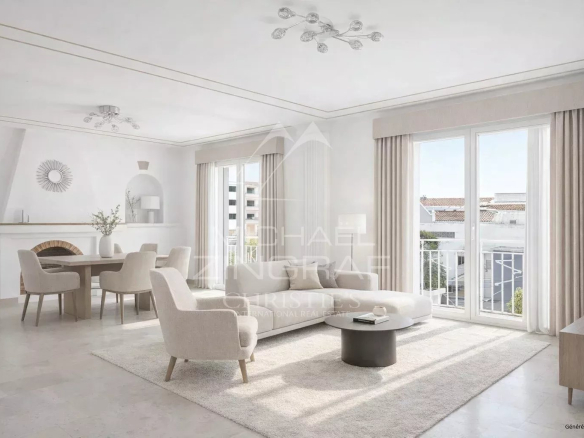 Intérieur d'un appartement lumineux avec salon moderne et vue sur la mer.