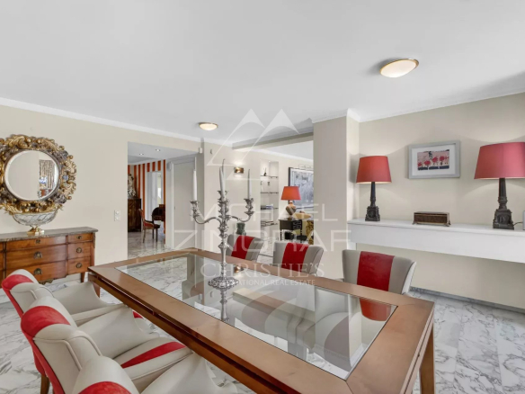 Interior of a luxury apartment in Cannes with elegant dining room and refined decor.