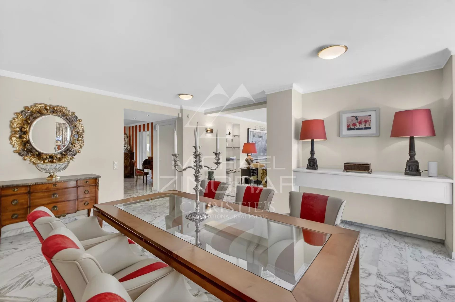 Interior of a luxury apartment in Cannes with elegant dining room and refined decor.