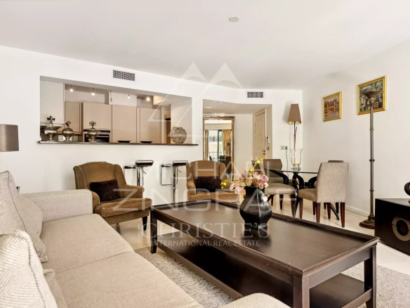 Interior of a contemporary apartment in Cannes with a bright living room and modern furniture.