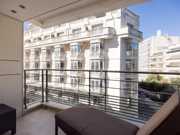 Terrace of an apartment in Cannes with views of surrounding buildings.