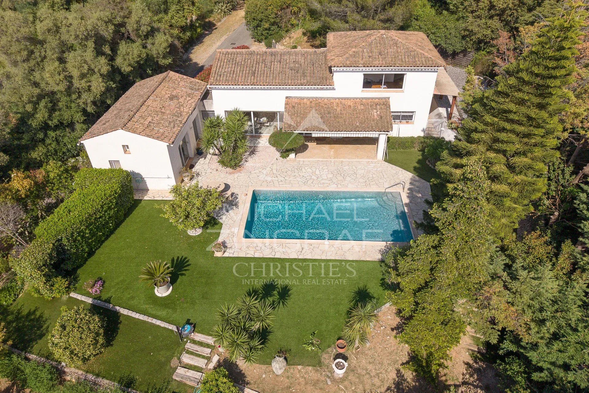 Villa with pool in Antibes Aerial view of a villa with swimming pool and garden in a gated community in Antibes.