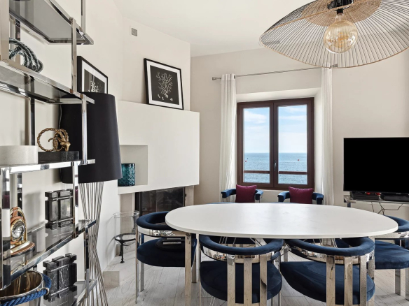Interior of an elegant house with a sea view, modern and bright furnishings.