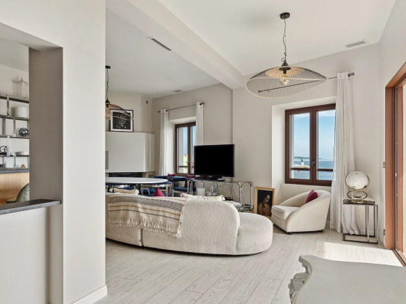Interior of an elegant house in Cannes with sea views, bright and modern living room.