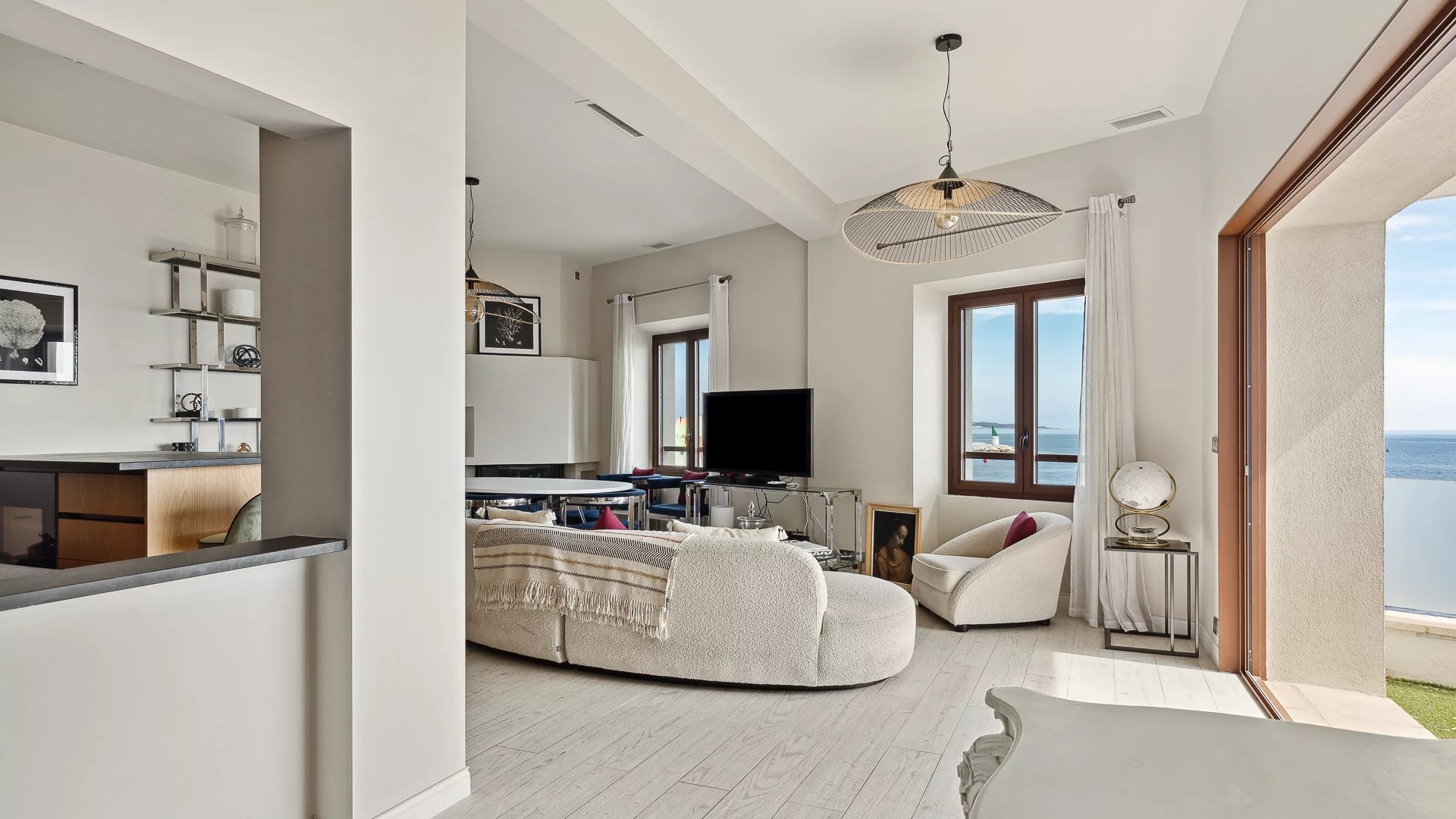 Living room of a house in Cannes Interior of an elegant house in Cannes with sea views, bright and modern living room.