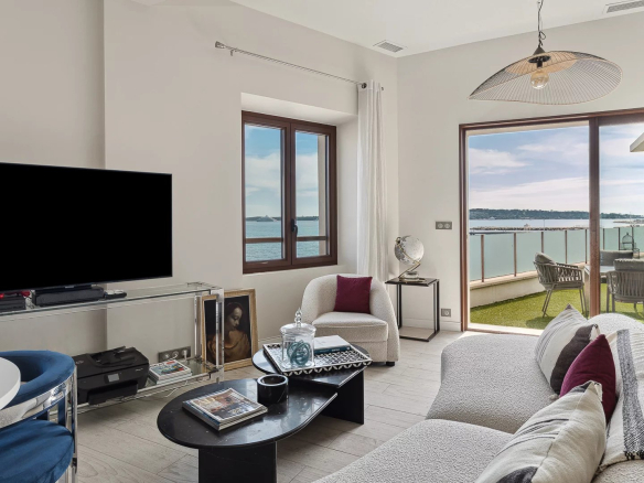 Interior of a renovated house in Cannes with sea view, bright and modern living room.