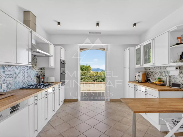 Modern and spacious kitchen in a stone villa in Vallauris with sea views.