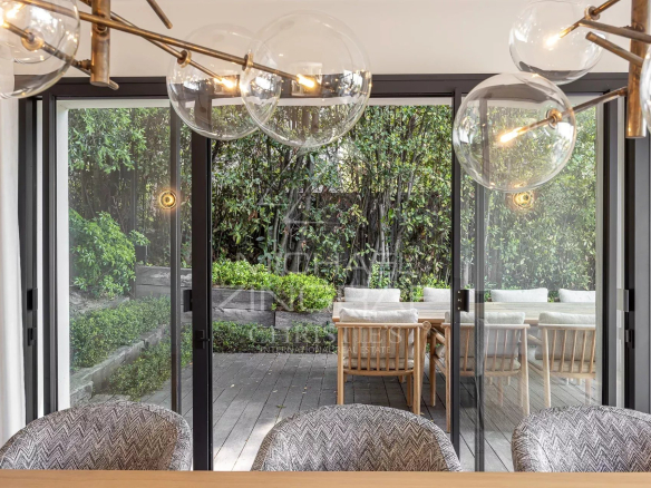 Interior of a contemporary villa in Cannes overlooking a garden and a terrace.