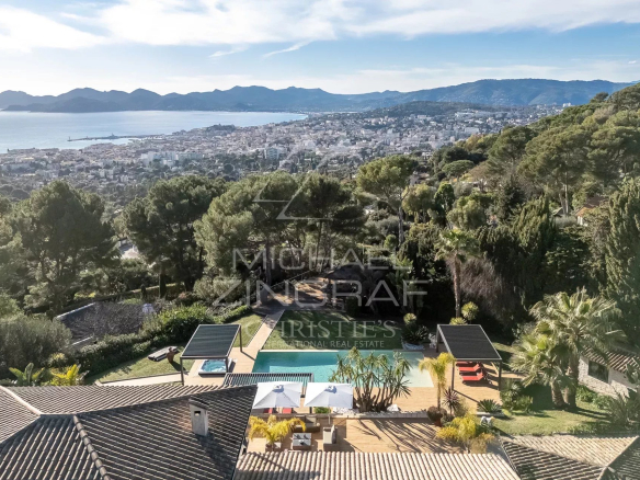 Panoramic sea view from a modern property in Cannes with swimming pool and garden.
