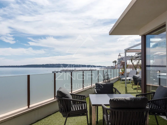 Terrace of a house in Cannes with sea view and outdoor furniture.