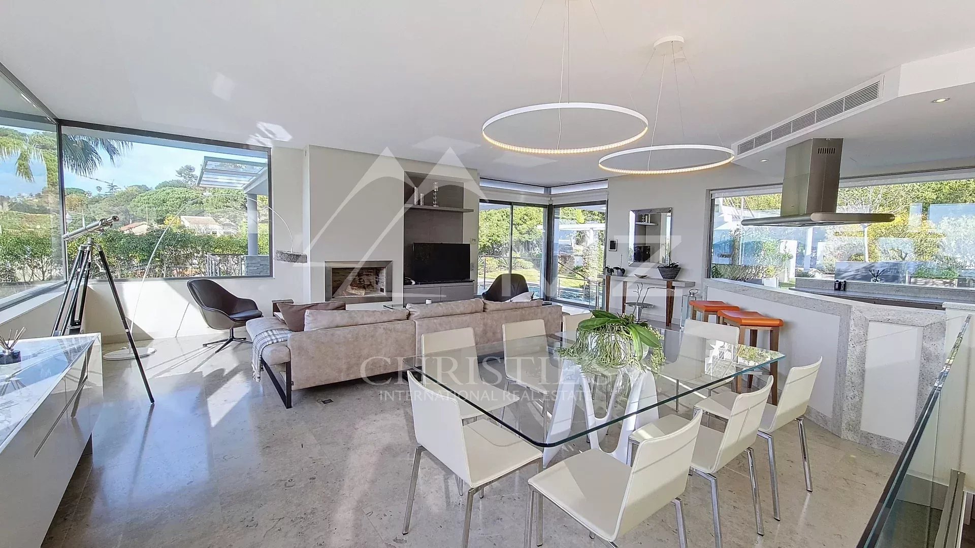 Contemporary villa in Cannes Interior of a contemporary villa in Cannes with sea views, modern living room and dining room.