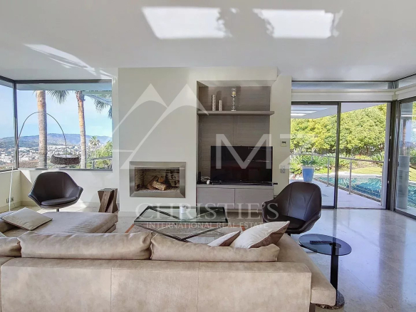 Interior of a contemporary villa in Cannes with sea views, bright and modern living room.
