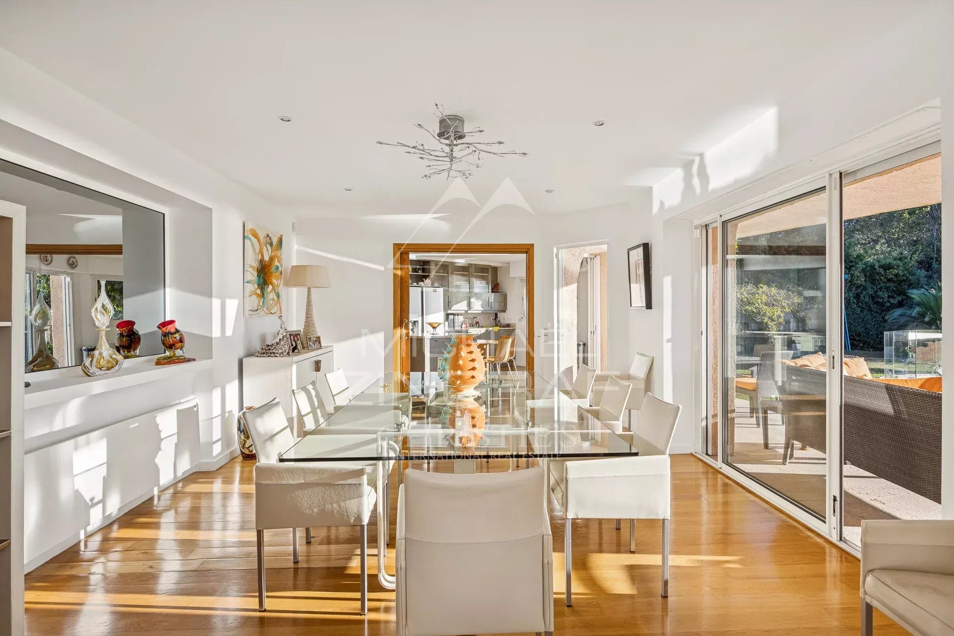 Interior of a modern villa with a bright dining room and sea view.