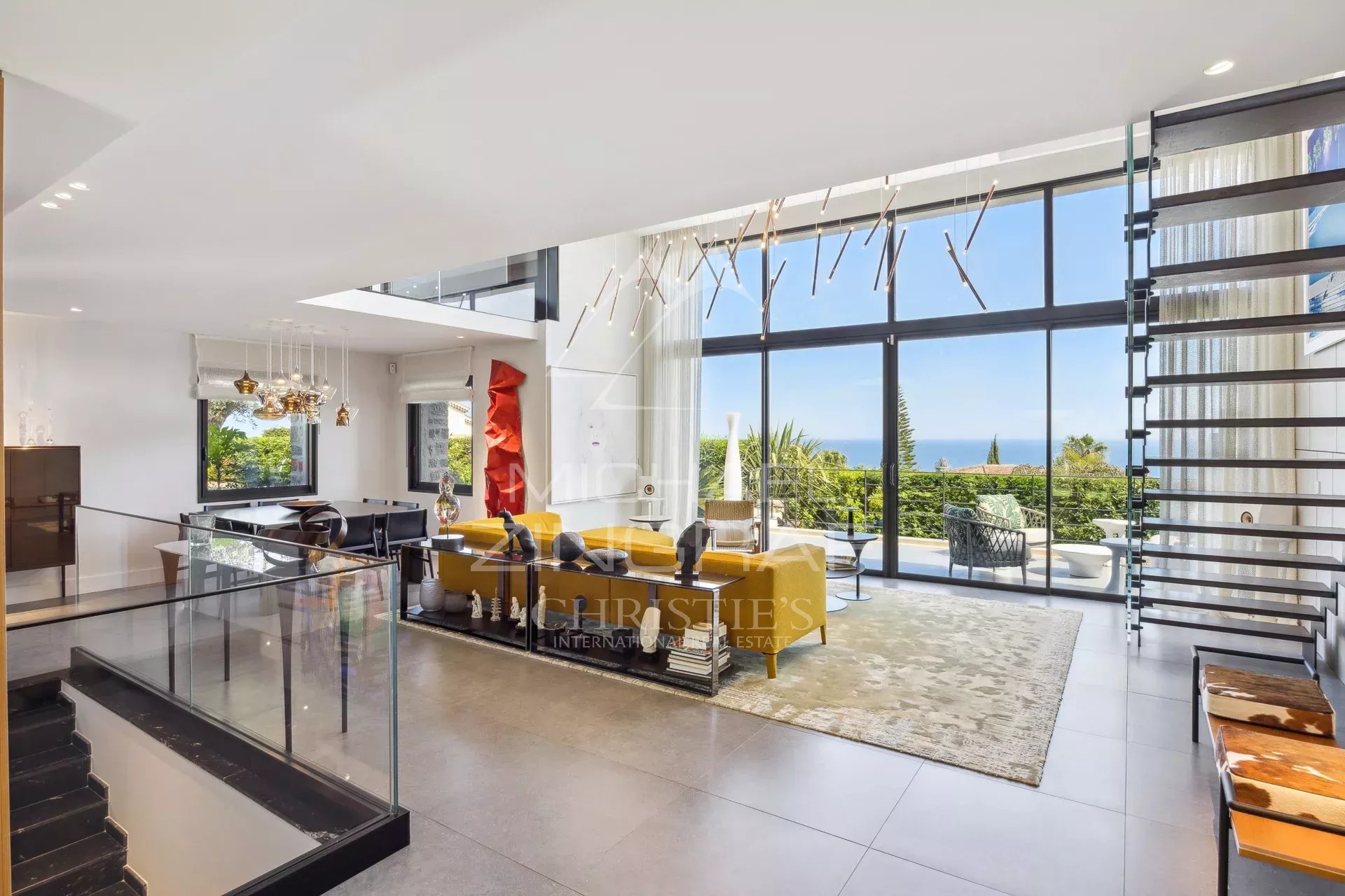 Modern villa in Cannes Eden Interior of a modern villa with panoramic sea views in Cannes, bright living room and contemporary decor.
