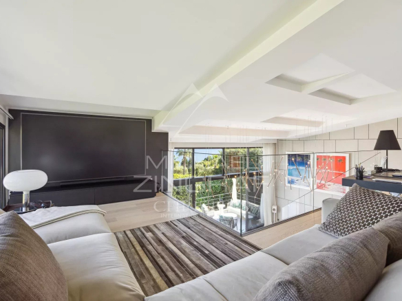 Interior of a modern villa in Cannes with sea views, bright living room and contemporary decor.