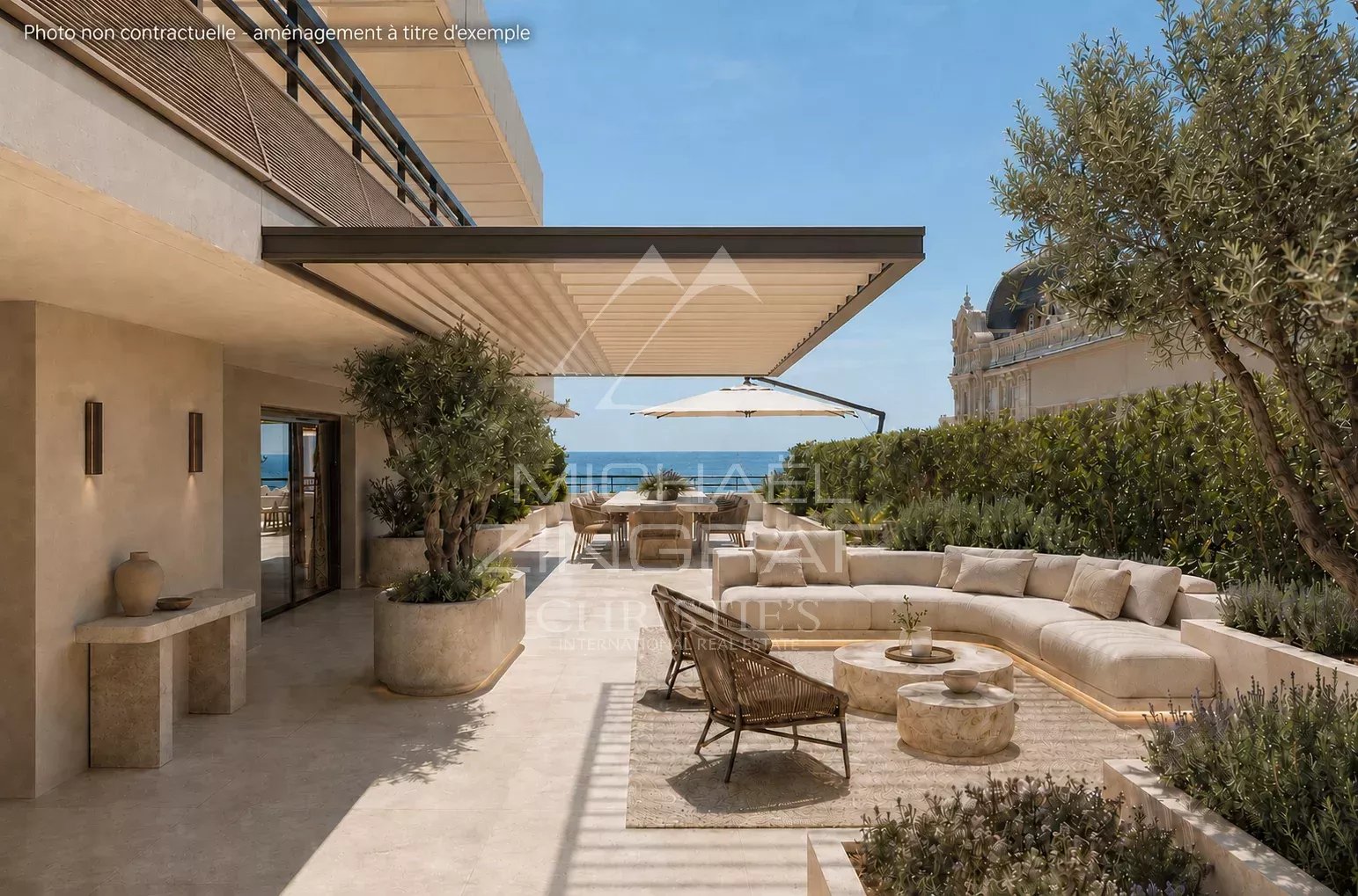 Spacious terrace of an apartment with sea view in Cannes, modern furniture and plants.