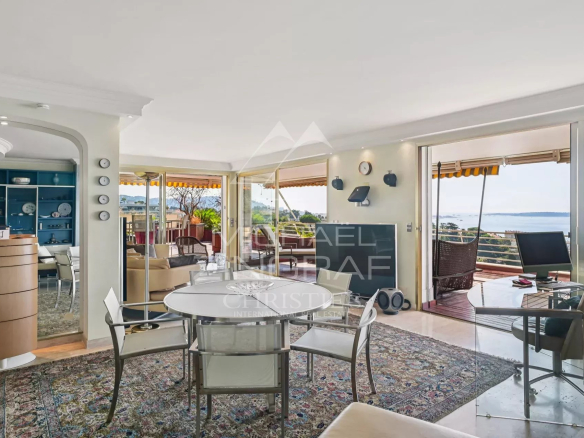 Interior of a 2-bedroom apartment in Cannes with sea view, bright living room and terrace.