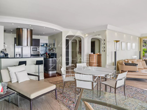 Interior of a 2-bedroom apartment in Cannes with living room, open kitchen and terrace.