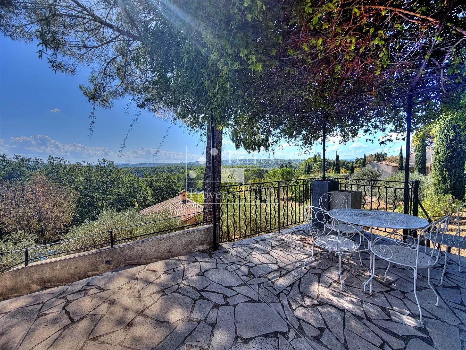 Terrace with a view in Lorgues Terrace with unobstructed views of nature, surrounded by trees and greenery in Lorgues.