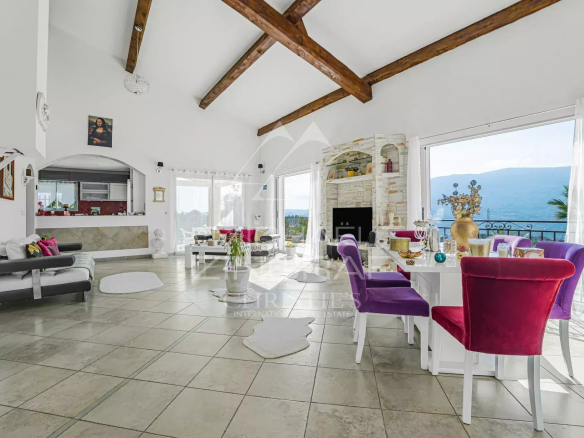 Interior of a family property in Colomars with views of the hills, bright living room and modern furniture.