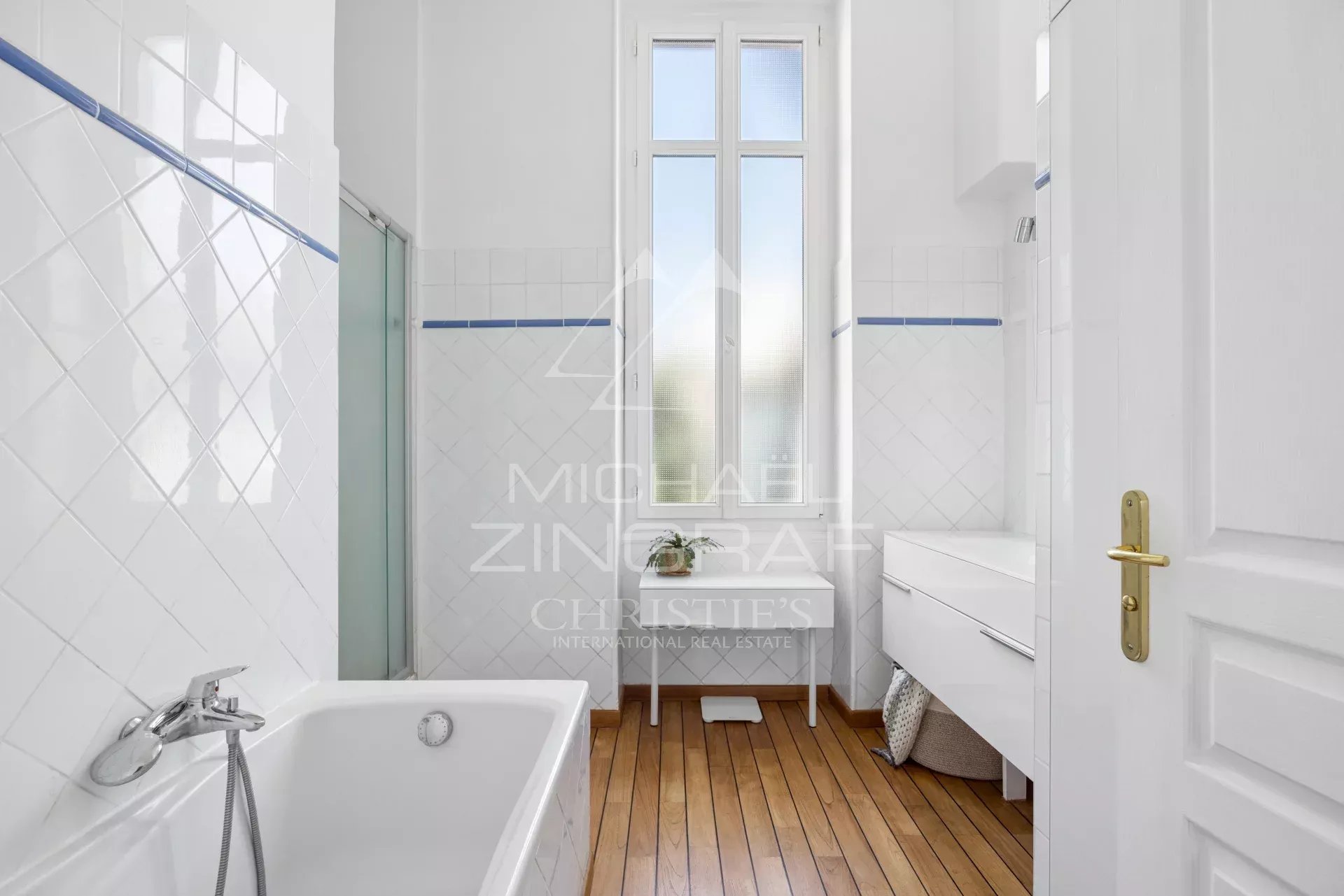 Bathroom of an apartment in Nice Bathroom in a Nice apartment with bathtub and bright window.