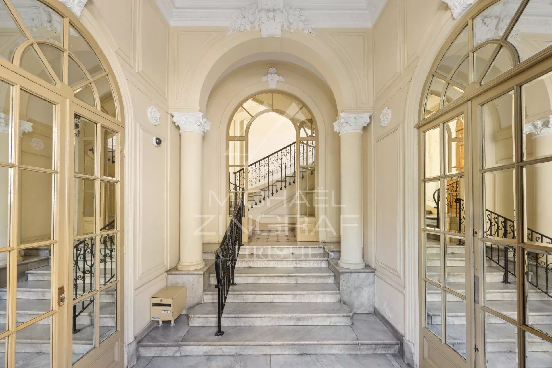 Entrance to a characterful building in Nice Entrance to an elegant old building with marble staircases and ornate walls in Nice.
