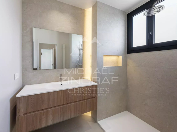 Modern bathroom with shower and wooden vanity