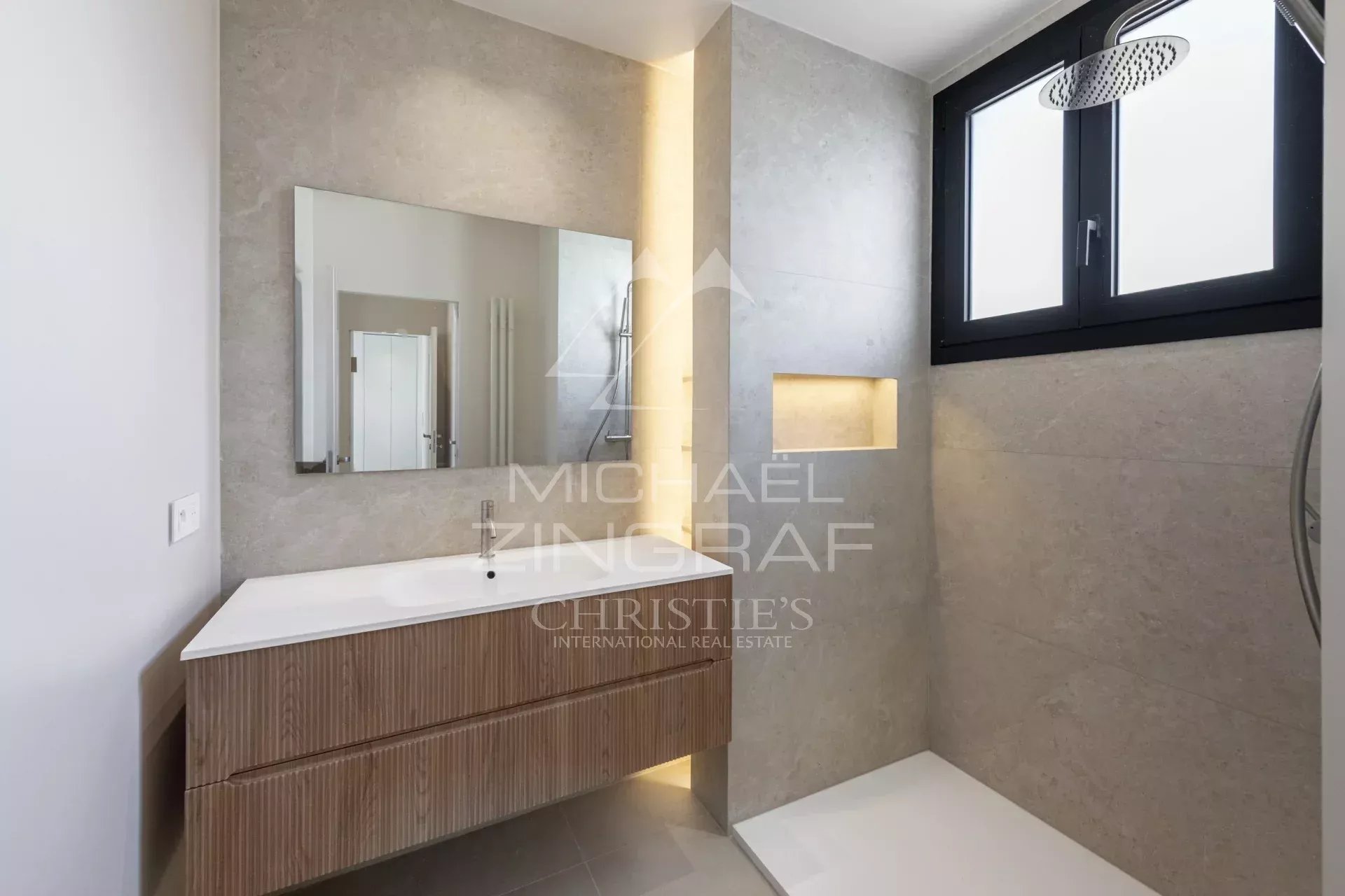 Modern bathroom with shower and wooden vanity