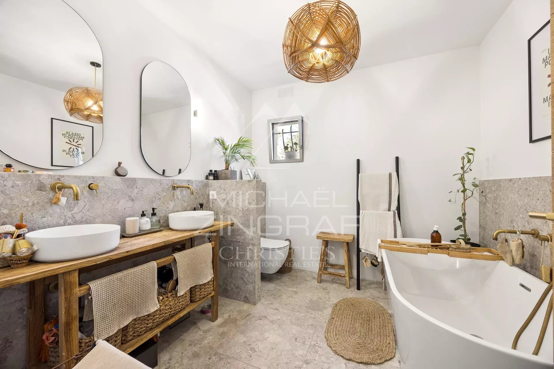 Renovated bathroom Modern bathroom with bathtub and double marble sink