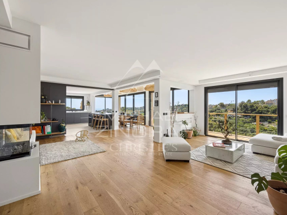 Interior of a renovated property in Nice with views of the hills and the sea.