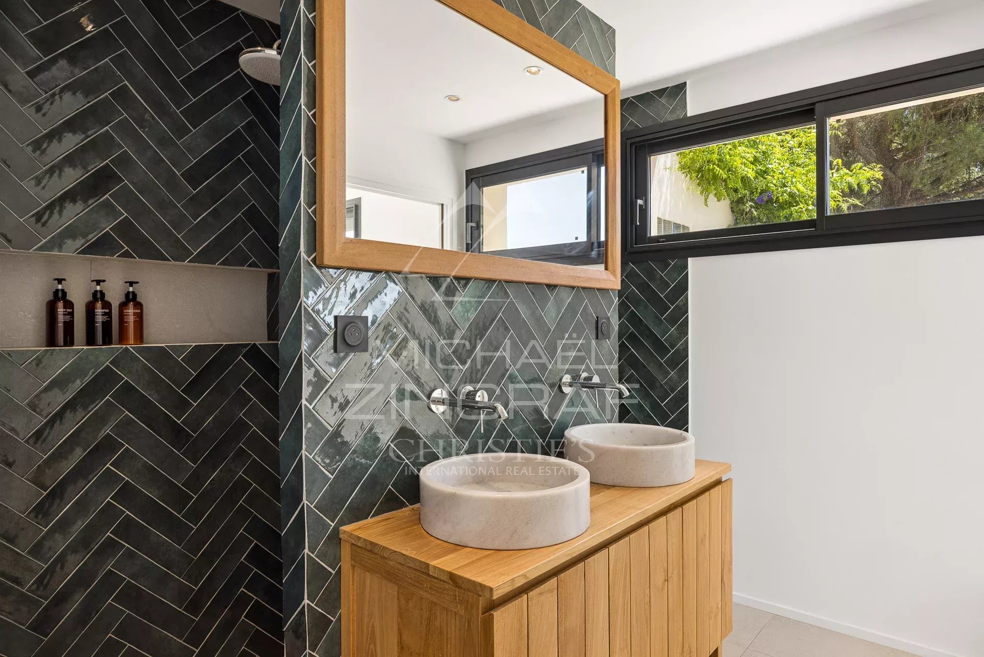 Renovated bathroom Modern bathroom with double vanity and mirror, herringbone tiled floor