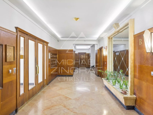 Entrance hall of a residence in Nice with mailboxes and elegant decoration.