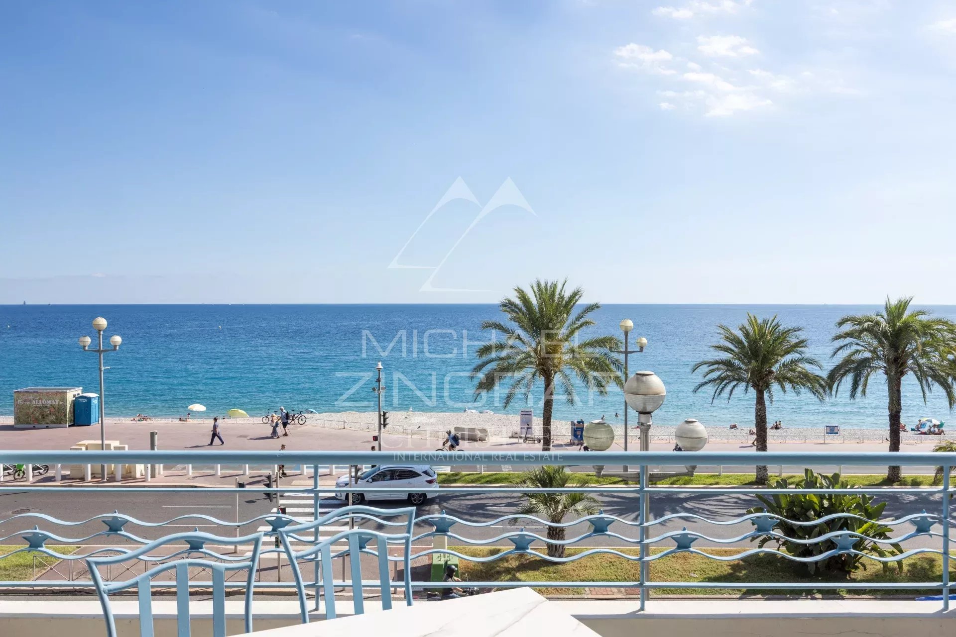 View from a terrace in Nice Sea view from an apartment terrace in Nice, with palm trees and the Promenade des Anglais in the background.