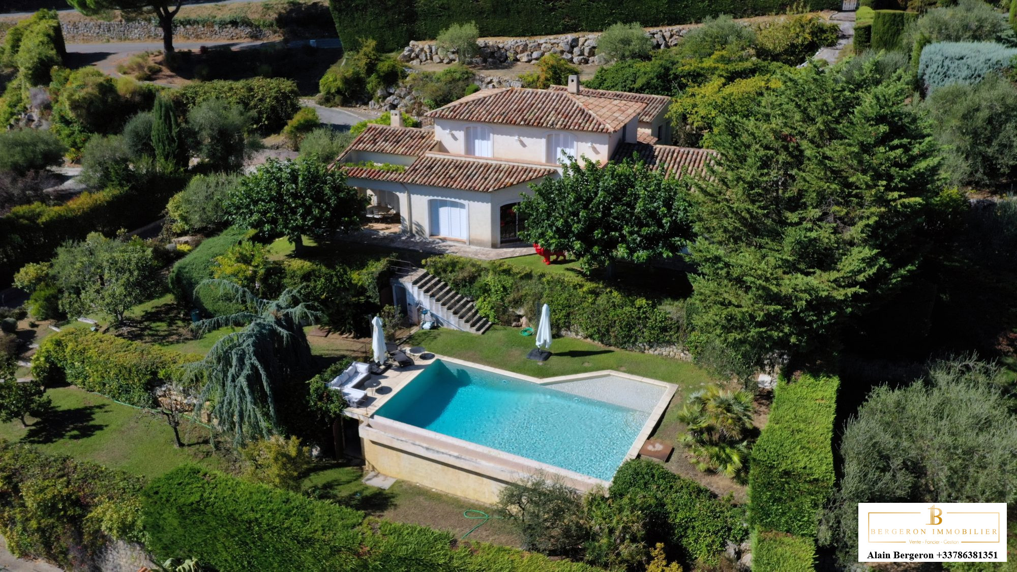 Luxury villa in Cabris Aerial view of a villa with swimming pool and garden in Cabris, France.