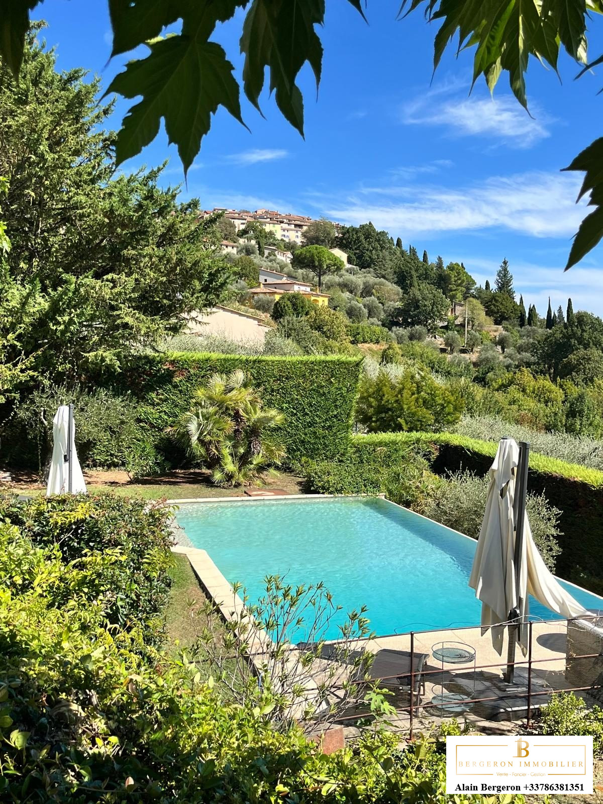 Luxury villa in Cabris View of a villa with a swimming pool surrounded by greenery in Cabris.