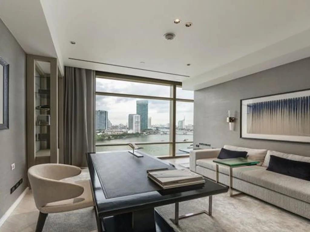 Interior of a luxury apartment in Bangkok with a view of the city.