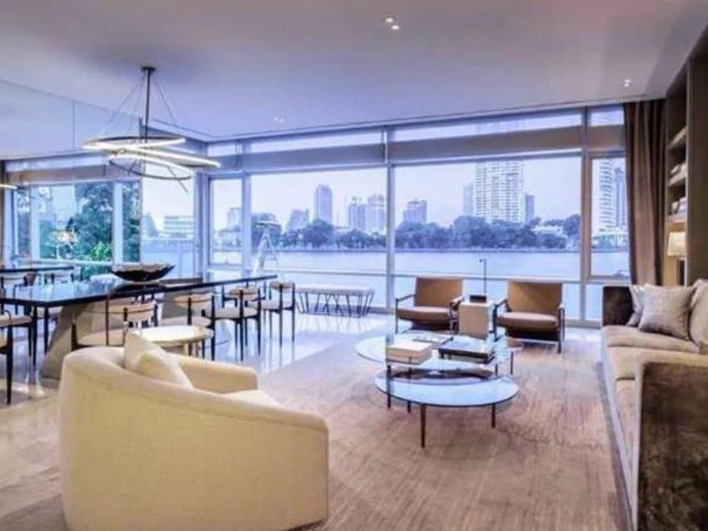Interior of a luxury apartment with a modern living room and city view in Bangkok, Thailand.