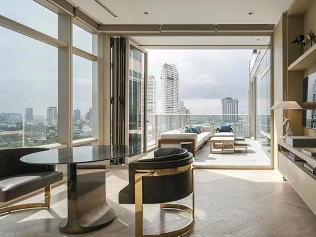 Interior of a luxury apartment in Bangkok with a view of the city.