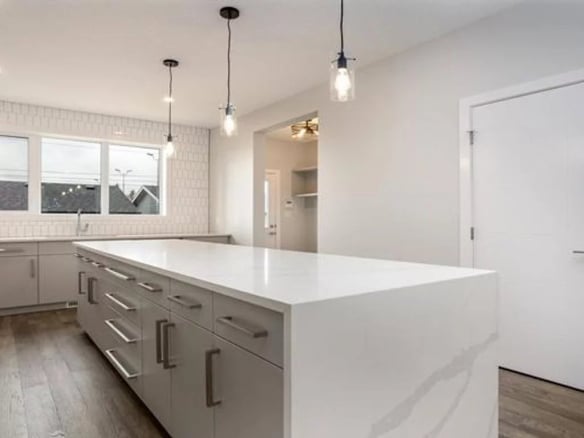 Modern kitchen in a luxury apartment with a large worktop in Bangkok, Thailand.